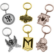 Custom logo keychains in gold silver and rose gold featuring personalized business and brand designs