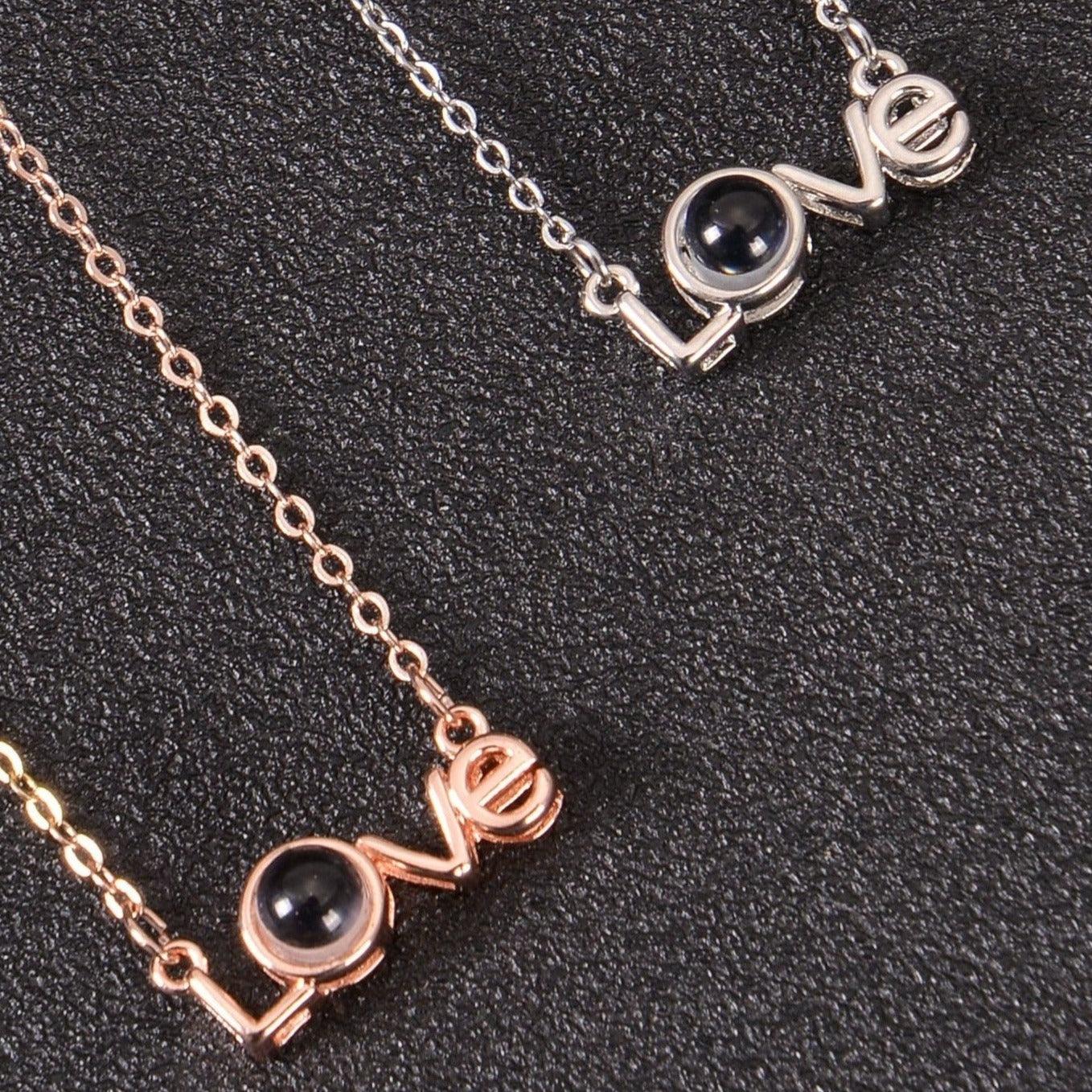 Two color options of custom Love necklace side by side