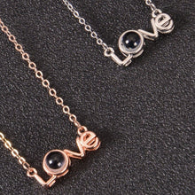 Two color options of custom Love necklace side by side