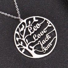 Silver personalized Tree of Life necklace featuring custom family names on a round pendant.