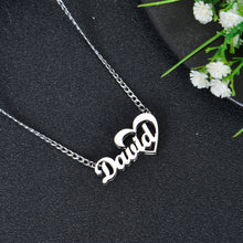 Silver custom script name necklace with cursive text David flowing into an open heart outline pendant on fine link chain.