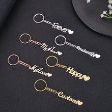 Pendantify personalized name keychain featuring custom cursive script nameplate ending with a solid heart charm tail in gold, rose gold, and silver.