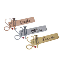 Trio of rose gold, silver, and gold personalized nurse brooches displayed diagonally on plain white background.