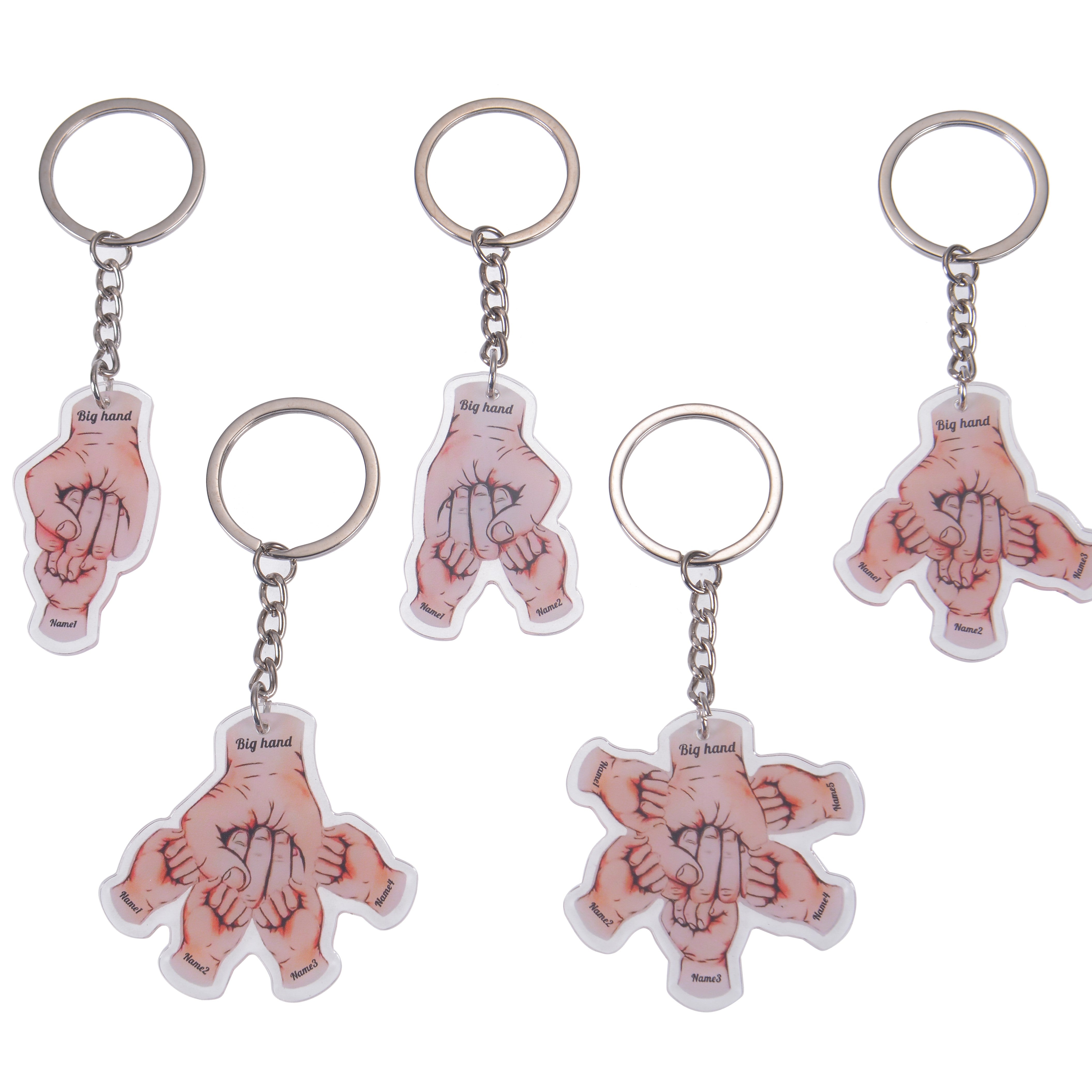 Five fist bump keychain variations shown together