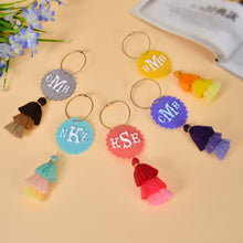 Collection of custom acrylic initial keychains with tassels