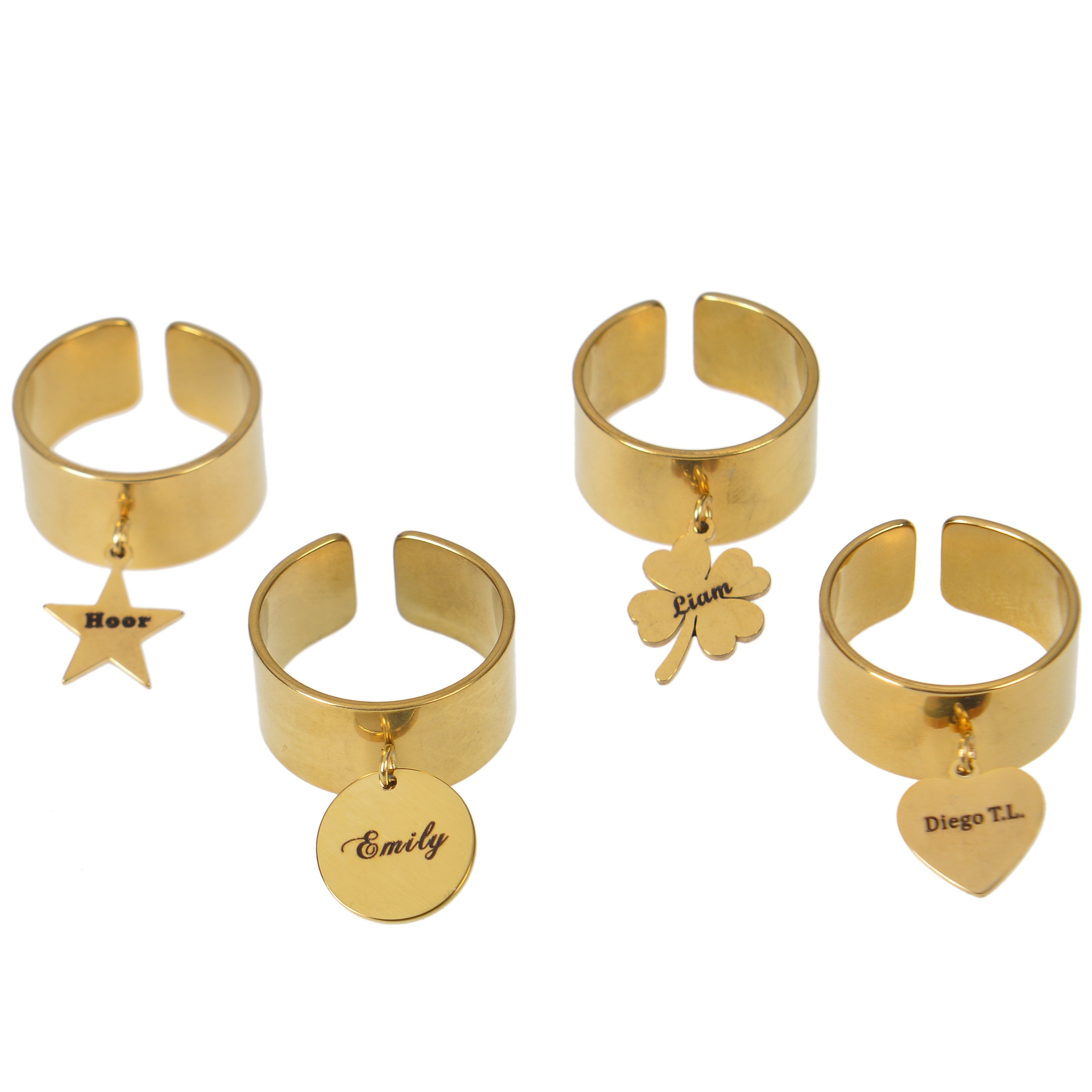 Display of four gold open cuff wide band rings showcasing various custom engraved charm shapes on white background.