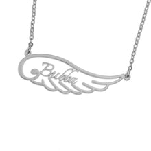 Detailed view of custom engraved name pendant with angel wing design