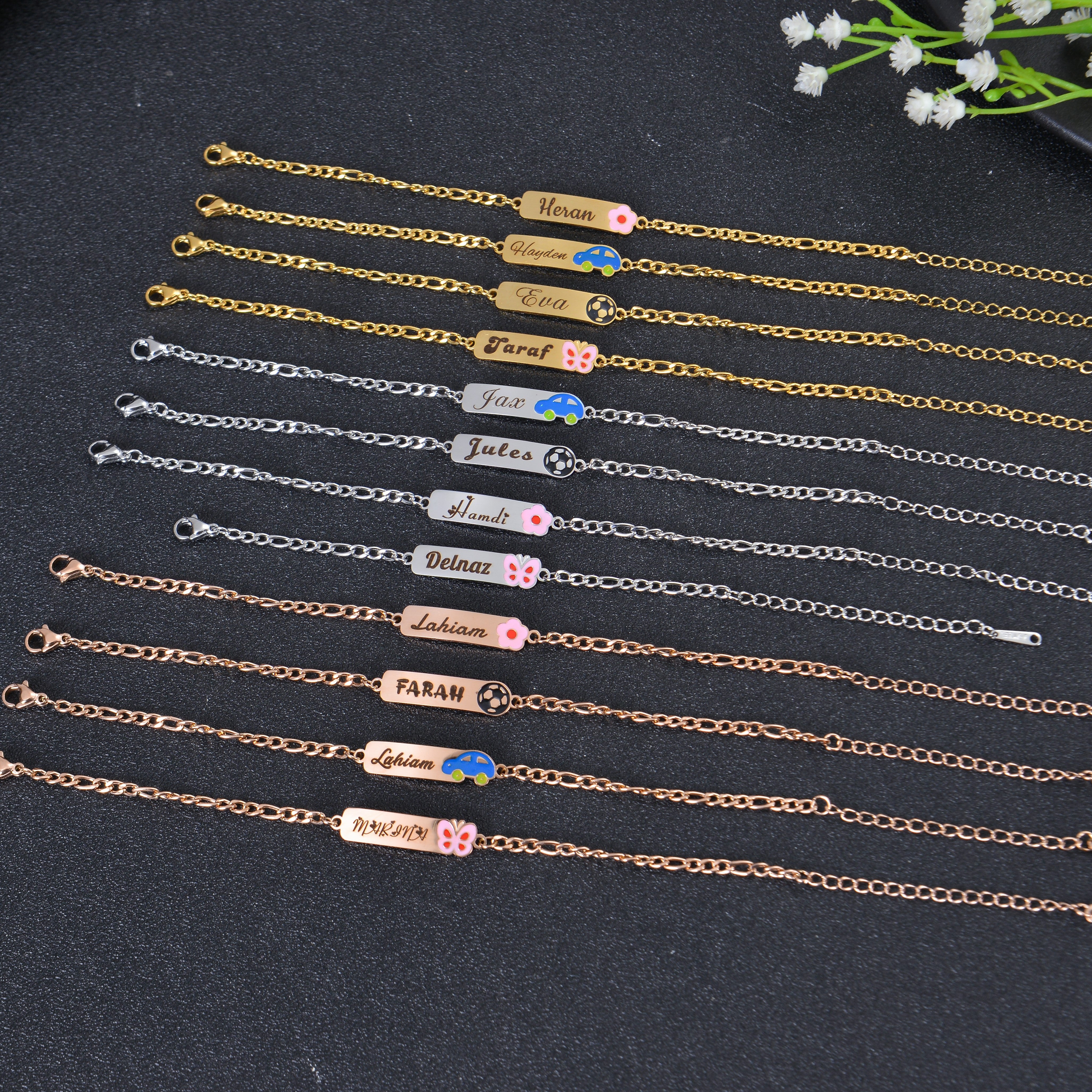 Pendantify personalized name bar bracelets featuring engraved names with colorful emoji icons in rose gold, gold, and silver finishes.