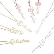 Custom carnation birth flower necklace featuring vertical name charm on gold link chain.
