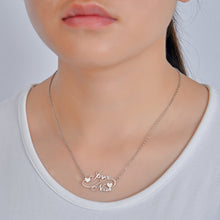 Woman wearing personalized double name necklace