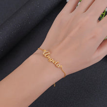 Model wearing gold name bracelet as everyday jewelry