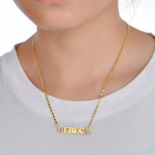 Woman wearing personalized old english nameplate necklace