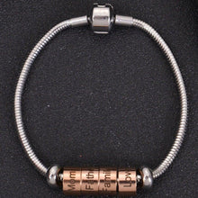 Rose gold custom family name beads stacked on stainless steel snake chain bracelet for custom family gift.