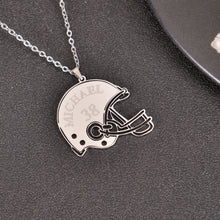 Silver personalized football helmet necklace featuring a custom name and jersey number pendant.