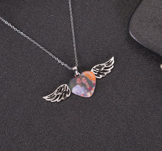 Personalized angel wings photo pendant necklace with a custom couple photo on a heart-shaped pendant.