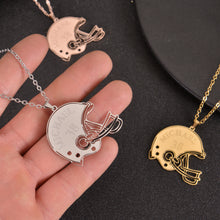 Close-up of a personalized football helmet pendant engraved with the name Michael and number 38.