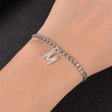Custom initial bracelet worn on the wrist