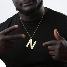 Model wearing personalized large initial necklace