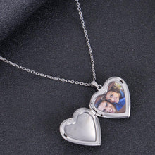 Silver personalized heart locket necklace shown in open position holding custom photo memorial insert.