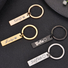Gold, rose gold, black, and silver keychains shown together