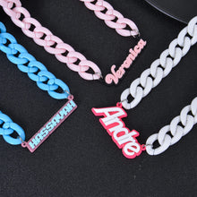 Multiple acrylic name necklaces displaying different names